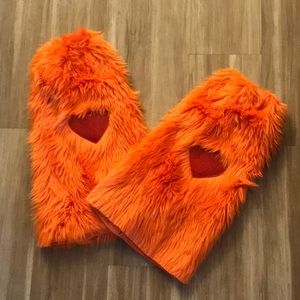 Fuzzy orange leg warmers with red heart